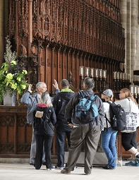 Visitors on a tour of Peterborough Cathedral. Click to book a Highlights Tour