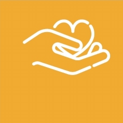 Hand holding heart shape on yellow background